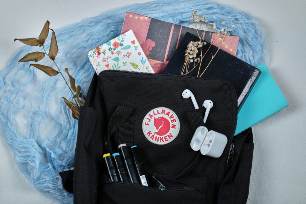 a backpack full of notebooks with headphones flow 2025 02 09 22 59 14 utc