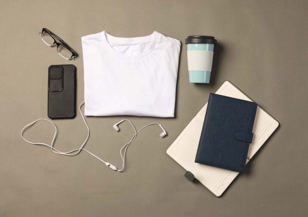 flat lay of white t shirt smartphone earphones a 2025 04 03 01 05 12 utc scaled e1755292352488