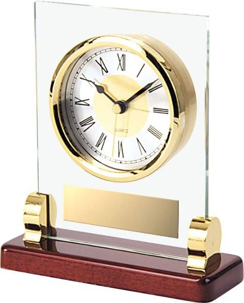 Elegant glass clock featuring a gold frame and wooden base, situated in Edmonton, AB