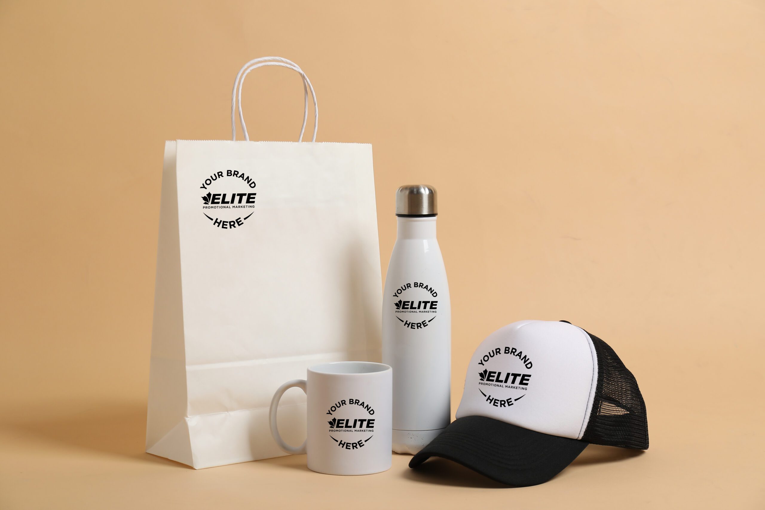 Different blank items for branding on beige background. Mockup for design